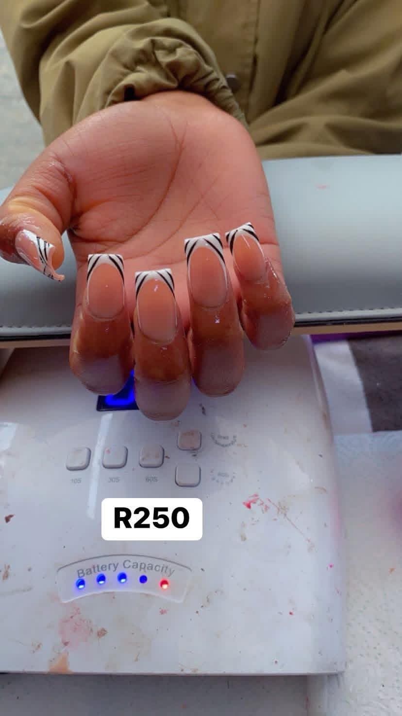 Long square nails with white French tips and black line art