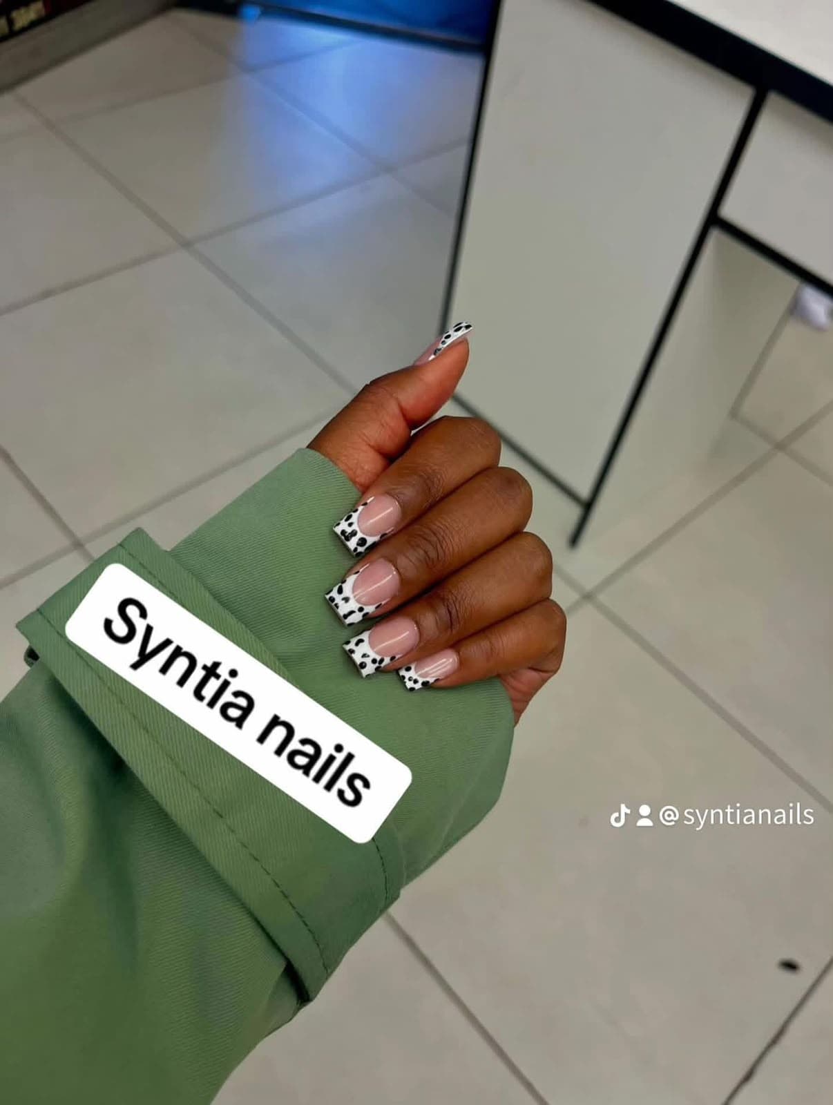 Square nails with white dalmatian print French tips