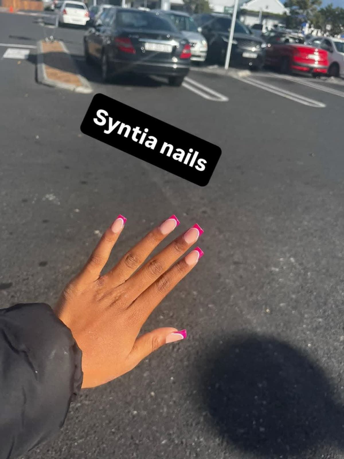 Short square nails with hot pink French tips and white outline