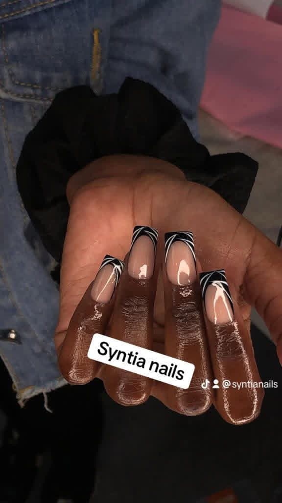 Square nails with black and white swirl French tips